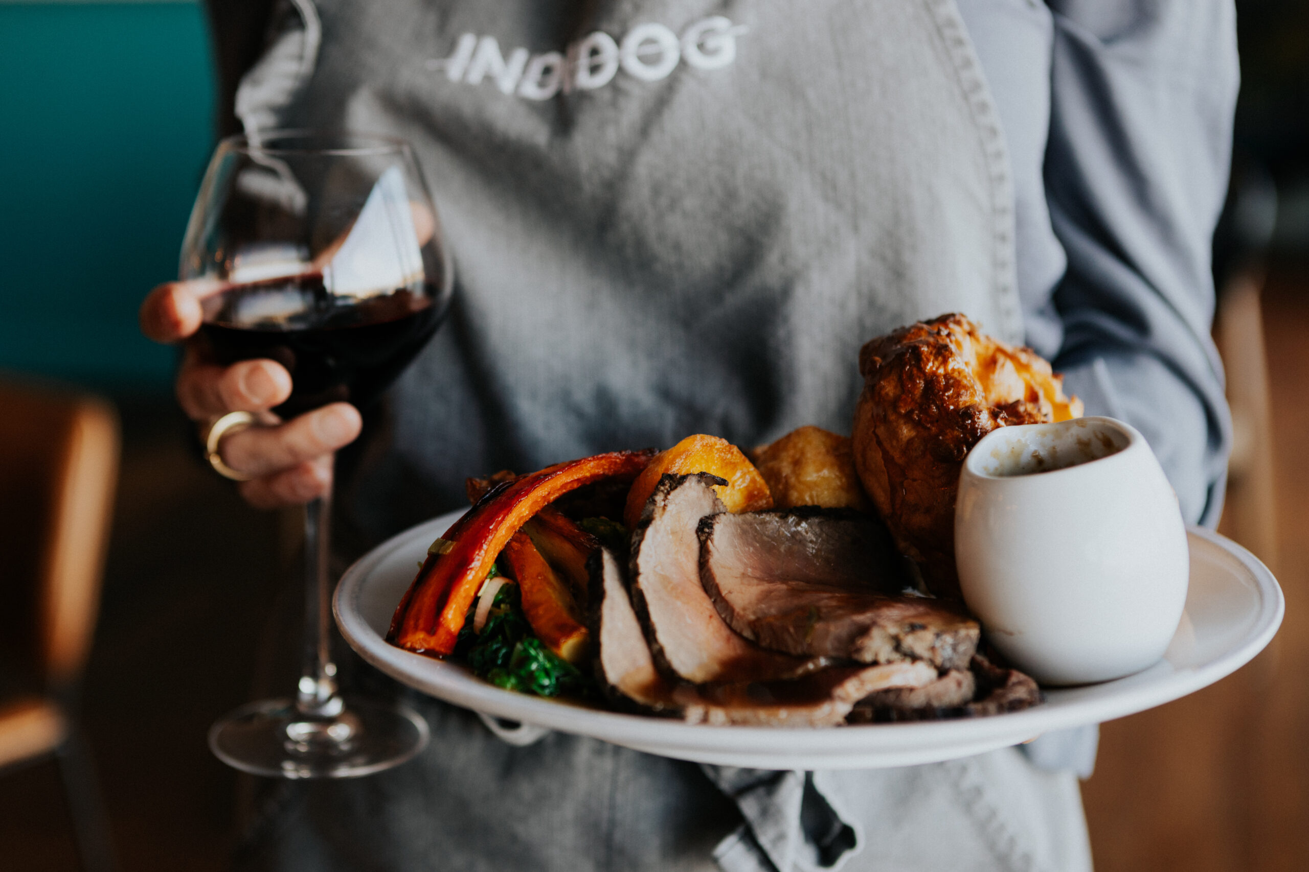 lizzie roast image with apron Sunday roast Falmouth. Cornwall, BEST ROAST IN CORNWALL